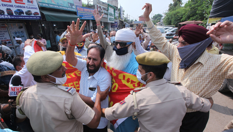 Protesting VRS given JKRTC workers being stopped by police near Dogra Chowk in Jammu on Wednesday. -Excelsior/Rakesh Protesting VRS given JKRTC workers being stopped by police near Dogra Chowk in Jammu on Wednesday. -Excelsior/Rakesh