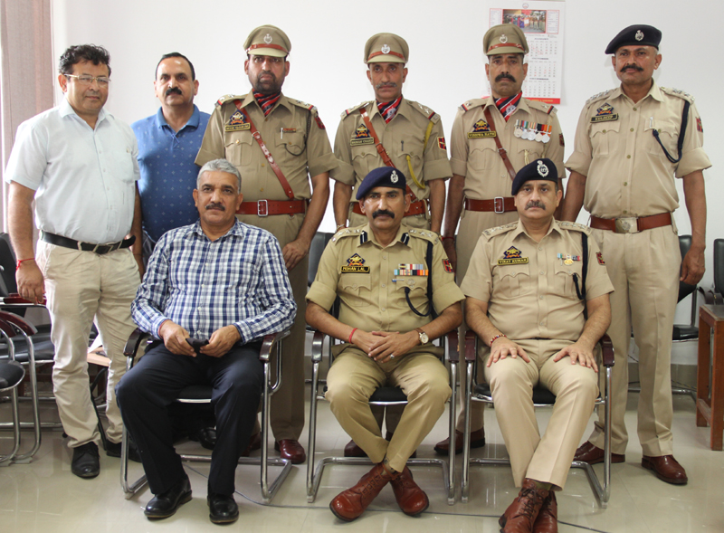 Promotees and police officers posing for group photograph. Promotees and police officers posing for group photograph.