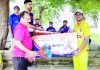 Ave Kachroo being awarded with man of the match by a dignitary of the event at KC Sports Ground Jammu on Tuesday.