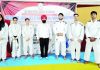 Judo coach Suraj Bhan Singh posing for a group photograph with selected Judokas at Indoor on Tuesday.