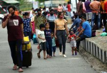 People head towards their destinations on foot as transport remained off the roads in protest against the murder of T S Wazir. -Excelsior/Rakesh