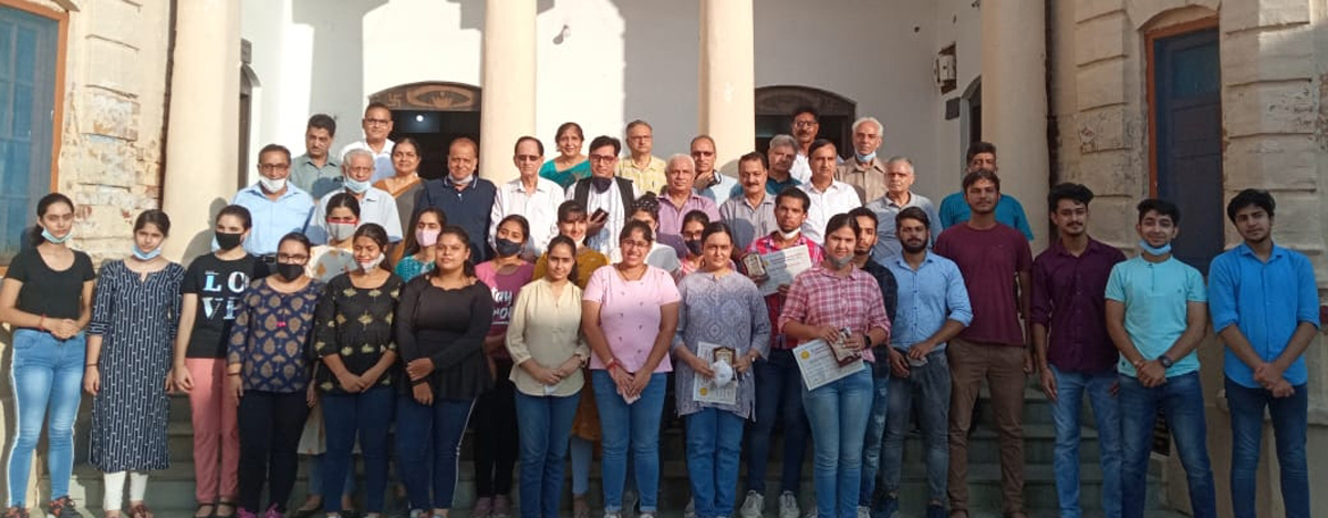 Dignitaries and felicitated students posing for group photograph. Dignitaries and felicitated students posing for group photograph.