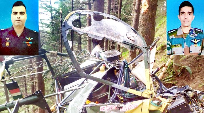Badly damaged helicopter after crash at Patnitop and (inset) Major Rohit Kumar and Major Anuj Rajput. -Excelsior/K Kumar