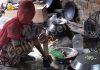 A woman cooks food on a clay stove in Jammu. — Excelsior/Rakesh