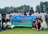 Winning team posing for a group photograph by holding banner of the championship at Jammu.