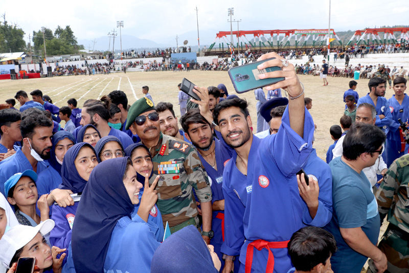 Participants of Sports Festival taking selfie with GOC, Lieutenant General DP Pandey at Shopian on Tuesday.