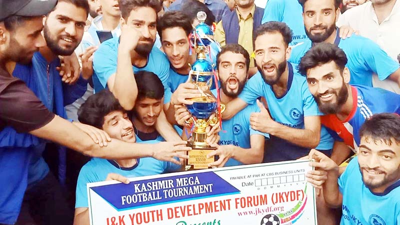 Winning team posing for a group photograph along with trophy at Ganderbal on Saturday. Winning team posing for a group photograph along with trophy at Ganderbal on Saturday.