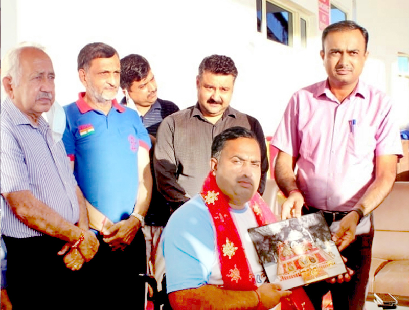 CEO SMVDSB, Ramesh Kumar felicitating Para archer- Rakesh Kumar at Katra on Tuesday. CEO SMVDSB, Ramesh Kumar felicitating Para archer- Rakesh Kumar at Katra on Tuesday.