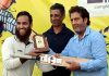 Skipper Muneeb Manaf being awarded with man of the match by organisers at Srinagar.