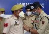 ADGP Mukesh Singh honouring a cop with DGP's Commendation Medal at Jammu on Monday.