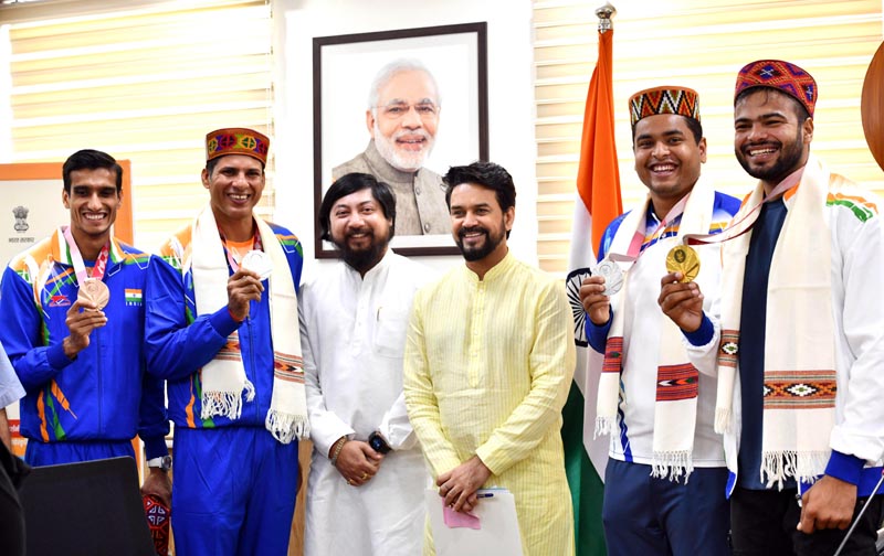 Union Minister of Youth Affairs and Sports Anurag Singh Thakur along with MoS Nitish Pramanik pose for a photograph with Medal winners of Tokyo 2020 Paralympics Sharad Kumar, Devendra Jhajharia, Sumit Antil and Yogesh Kathuniya in New Delhi on Friday. (UNI) Union Minister of Youth Affairs and Sports Anurag Singh Thakur along with MoS Nitish Pramanik pose for a photograph with Medal winners of Tokyo 2020 Paralympics Sharad Kumar, Devendra Jhajharia, Sumit Antil and Yogesh Kathuniya in New Delhi on Friday. (UNI)