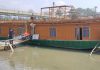 SDRF officials pumping water out from damaged houseboat in River Jhelum, Srinagar. -Excelsior/Shakeel