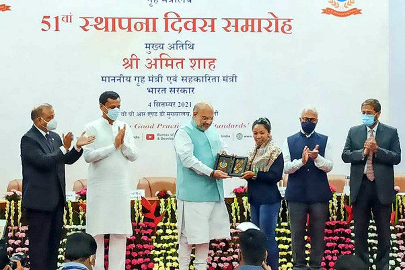 Union Home Minister Amit Shah felicitates silver medal winner boxer Mirabai Chanu during the 51st foundation day event of the Bureau of Police Research and Development (BPRD), in New Delhi. Union Home Minister Amit Shah felicitates silver medal winner boxer Mirabai Chanu during the 51st foundation day event of the Bureau of Police Research and Development (BPRD), in New Delhi.