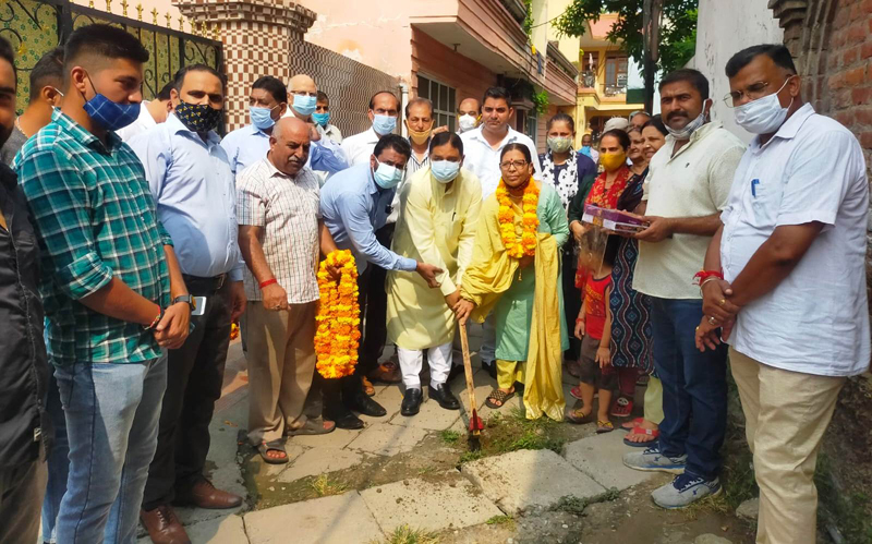 Former Minister Sat Sharma along with Councillor Neelam Nargotra starting deep drain work on Kamla Palace road on Monday. Former Minister Sat Sharma along with Councillor Neelam Nargotra starting deep drain work on Kamla Palace road on Monday.