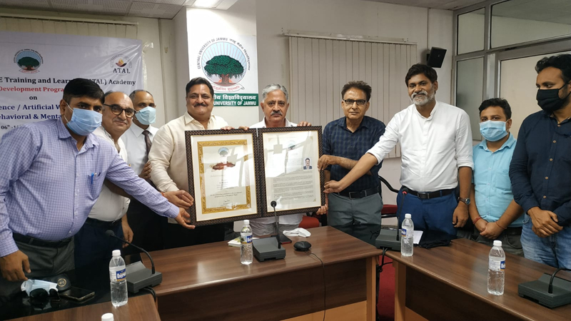 VC CUJ Prof Ashok Aima and other faculty members posing with former JMC Commissioner Kiran Wattal after honouring him. VC CUJ Prof Ashok Aima and other faculty members posing with former JMC Commissioner Kiran Wattal after honouring him.