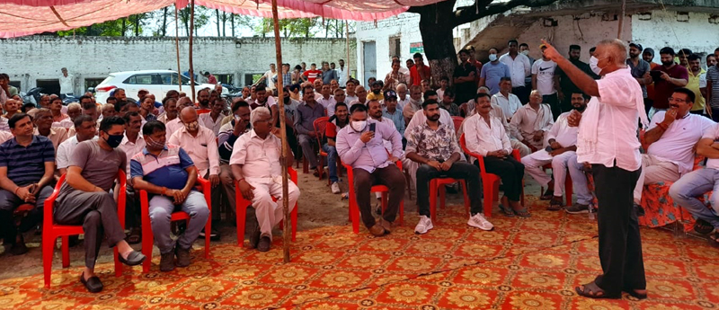 Former Minister, Ch Sukhnandan addressing a gathering in Rathua, Marh on Sunday.