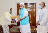 Lt Governor Manoj Sinha handing over grocery kit to a needy woman in Jammu on Wednesday.