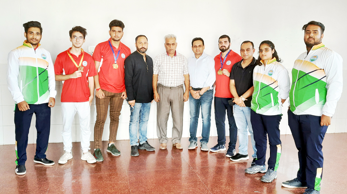 Winners posing a group photograph with Divisional Sports Officer Jammu, Ashok Singh at Jammu on Tuesday.