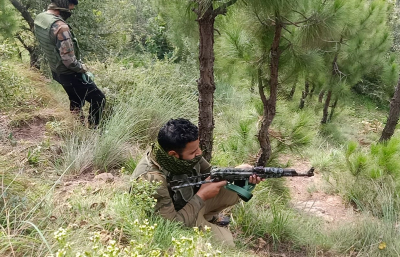 Army jawans in action at Bhatta Durrian forests of Mendhar on Friday. -Excelsior/Rahi Kapoor Army jawans in action at Bhatta Durrian forests of Mendhar on Friday. -Excelsior/Rahi Kapoor