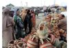 Women purchasing Kangri, the traditional Kashmiri firepot in Srinagar on Monday. (UNI)