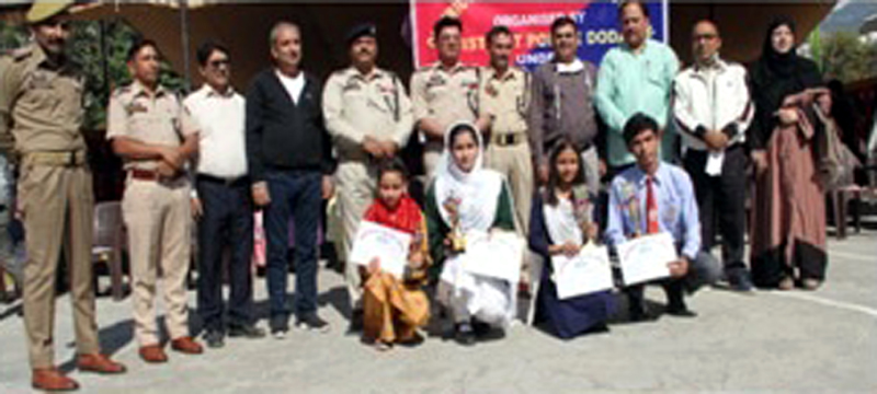 Police and civil officers with winners of debate competition in Doda on Friday. Police and civil officers with winners of debate competition in Doda on Friday.