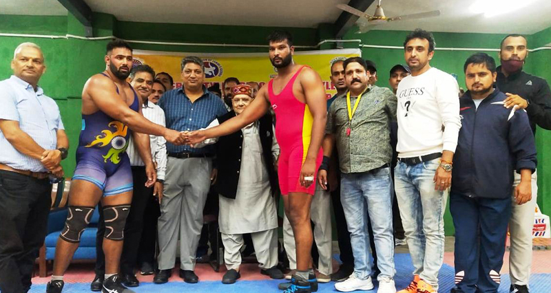 Former MLC Ashok Khajuria introducing wrestlers during the opening day of the Wrestling Championship at Jammu University. Former MLC Ashok Khajuria introducing wrestlers during the opening day of the Wrestling Championship at Jammu University.