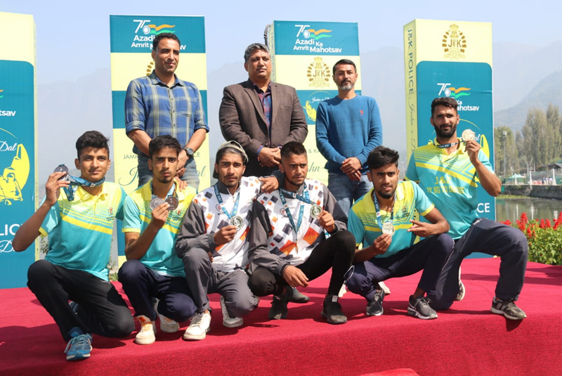 Winners of water sports events displaying medals while posing for photograph with dignitaries at Srinagar. Winners of water sports events displaying medals while posing for photograph with dignitaries at Srinagar.