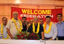 Newly re-elected president of Federation of Retailers Associations, Yash Paul Gupta being felicitated by JCCI president Arun Gupta and others after his election in Jammu on Sunday. -Excelsior/Rakesh