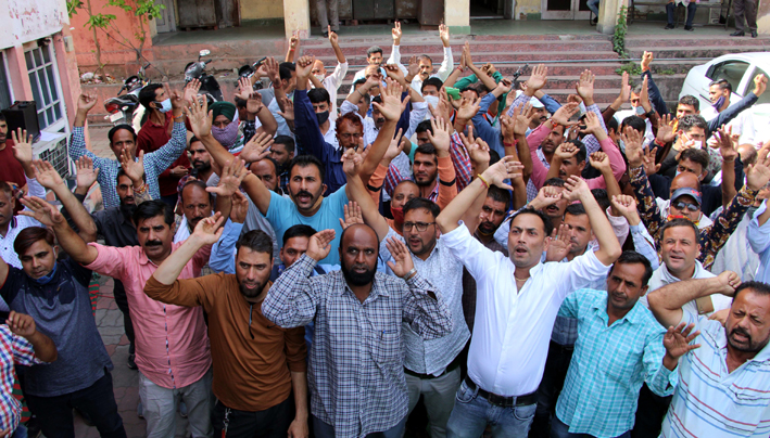 PHE daily wagers during a protest demonstration in Jammu on Monday. -Excelsior/Rakesh PHE daily wagers during a protest demonstration in Jammu on Monday. -Excelsior/Rakesh