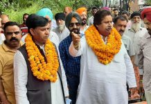 Senior Cong leader Raman Bhalla interacting with people in Digiana area on Sunday.