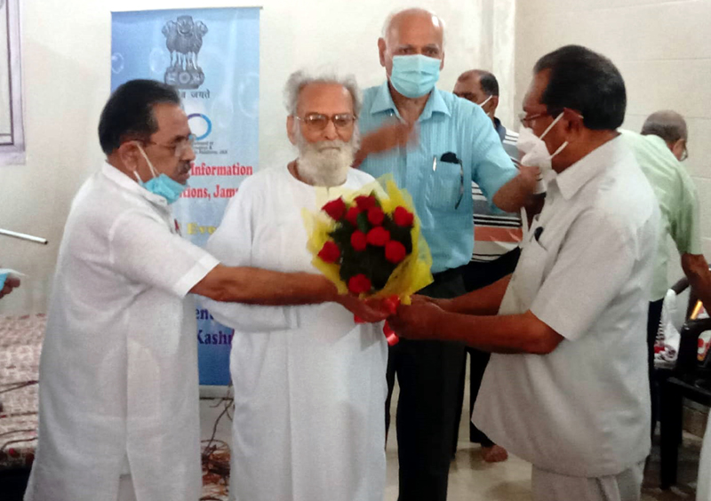 Dr R R Khajuria being honoured by AWSC president and others. Dr R R Khajuria being honoured by AWSC president and others.