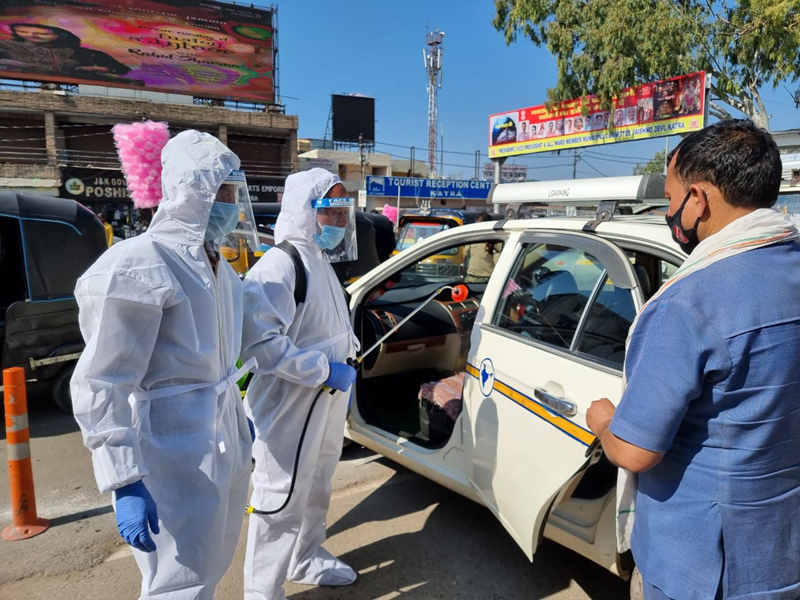 The drivers and conductors being made aware about traffic laws during COVID  pandemic in Katra on Saturday. - Jammu Kashmir Latest News | Tourism |  Breaking News J&amp;K