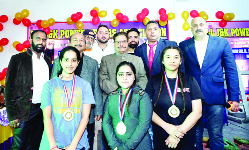 Winners posing for a group photograph with chief guest Gulchain Singh Charak at Jammu on Saturday.