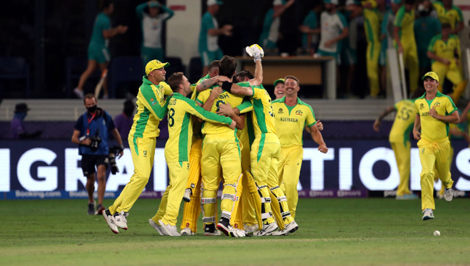 Australian players celebrating victory over New Zealand during T20 World Cup final match at Dubai on Sunday.