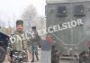 Troops at the site of encounter at Chawalgam in Kulgam on Thursday. —Excelsior/Sajad Dar