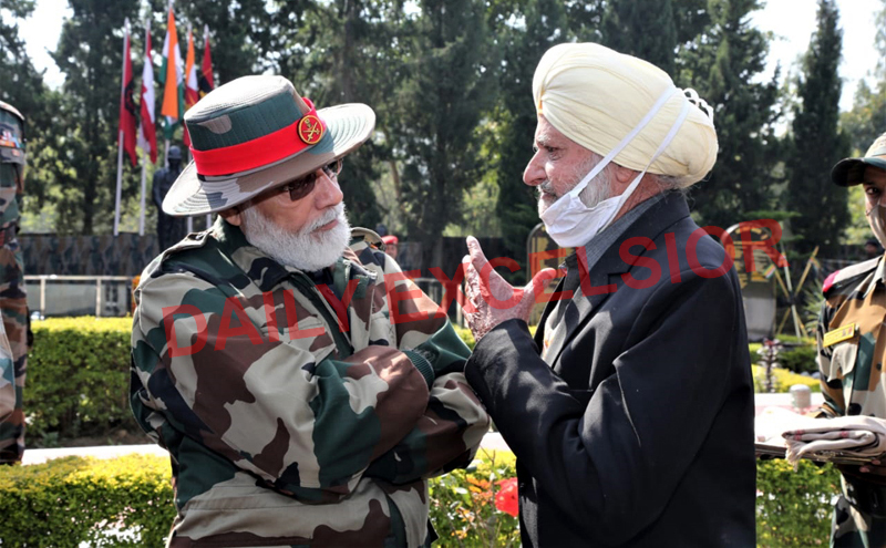 Prime Minister Narendra Modi listens to ‘Bal Sainik’ who played excellent role in 1947-48 war during his visit to Nowshera in Rajouri district. Prime Minister Narendra Modi listens to ‘Bal Sainik’ who played excellent role in 1947-48 war during his visit to Nowshera in Rajouri district.