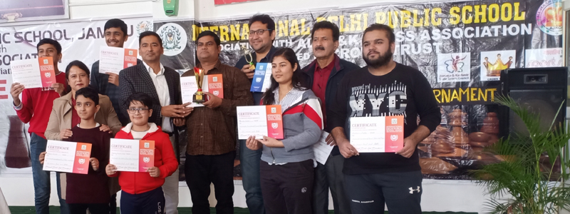 Winners of Chess championship displaying their meritorious certificates along with dignitaries at Jammu.