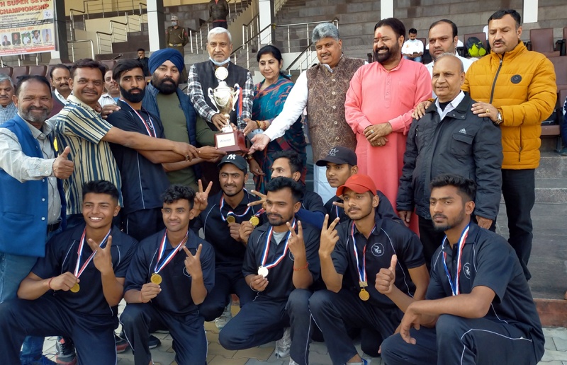 Former Minister Sham Lal Sharma and others presenting the trophy to the winning team at MA Stadium Jammu. Former Minister Sham Lal Sharma and others presenting the trophy to the winning team at MA Stadium Jammu.