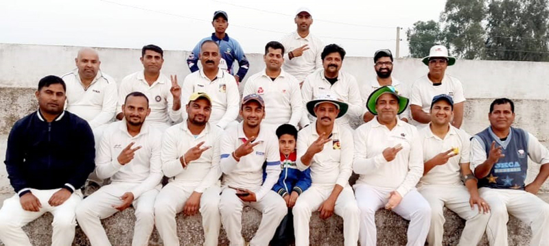 Winning team players showing victory signs while posing for a group photograph at Rehal Stadium Bishnah on Monday.