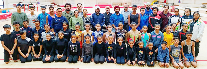 Participants of Gymnastic trials posing for a group photograph with dignitaries at MA Stadium Jammu on Saturday. Participants of Gymnastic trials posing for a group photograph with dignitaries at MA Stadium Jammu on Saturday.