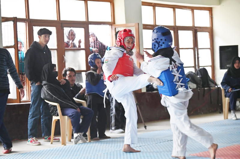 Players in action during a bout of Taekwondo Championship at Kargil on Tuesday. — Excelsior/Basharat Ladakhi Players in action during a bout of Taekwondo Championship at Kargil on Tuesday. — Excelsior/Basharat Ladakhi