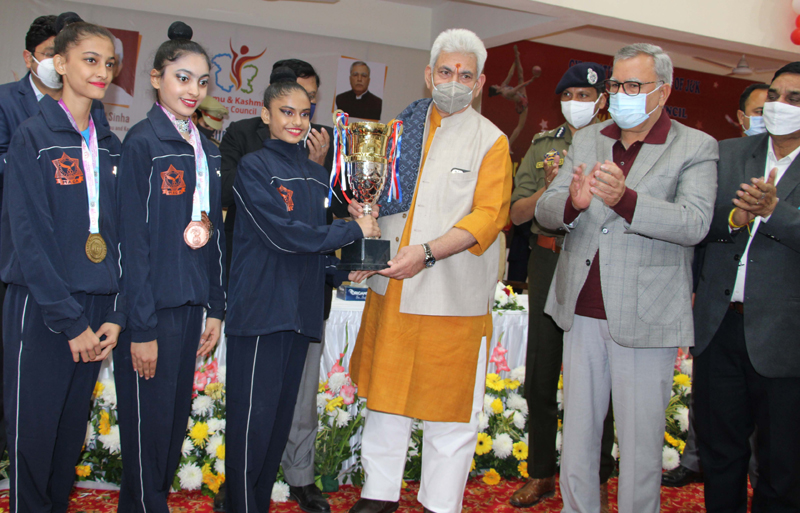 Lt Governor Manoj Sinha awarding winner team. —Excelsior/Rakesh