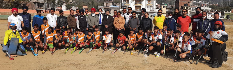 Director Sports Gazanffar Ali and participating players posing for group photograph.