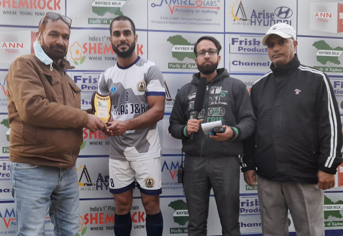 A player being awarded with a trophy by the dignitary at Srinagar on Wednesday.