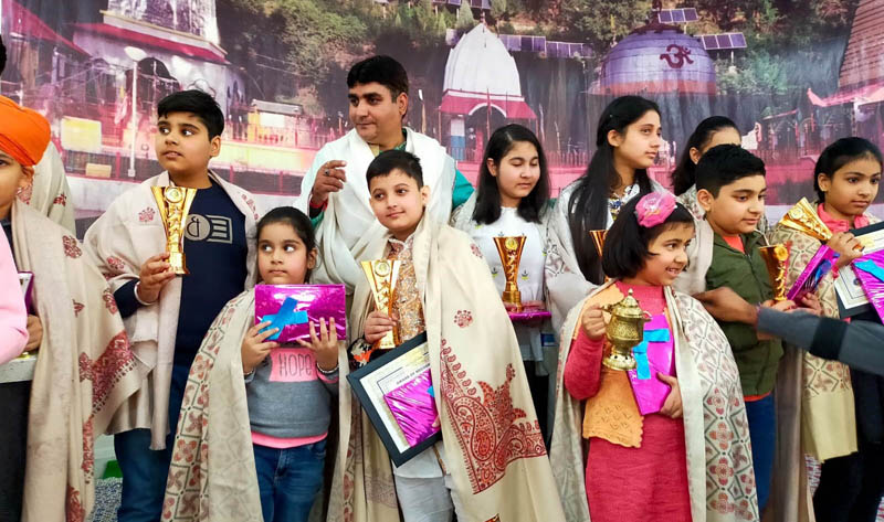 Winners displaying awards while posing for a group photograph at Jammu.