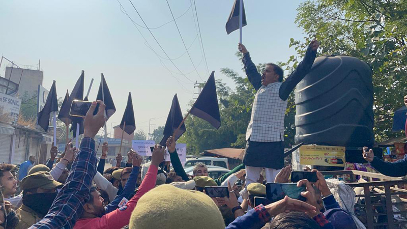 NPP activists carrying black flags during protest in Jammu on Wednesday. NPP activists carrying black flags during protest in Jammu on Wednesday.