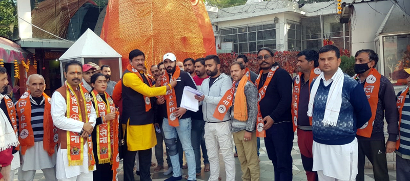 Shiv Sena leader Manish Sahni posing for a group photograph with party activists at Kol Kandoli temple in Nagrota.