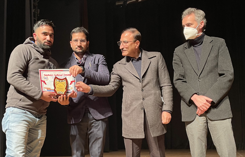 Dignitaries presenting award to Aabid Nabi in Srinagar.
