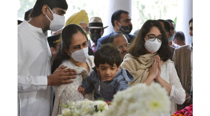 Daughters, son-in-law and grandson of CDS General Bipin Rawat and Madhulika Rawat paying last respects at their residence in New Delhi on Friday.