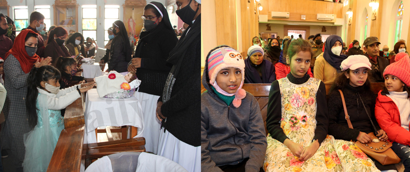Members of Christian community celebrating Christmas in Jammu (left) and Srinagar (right) on Saturday. — Excelsior/ Rakesh & Shakeel